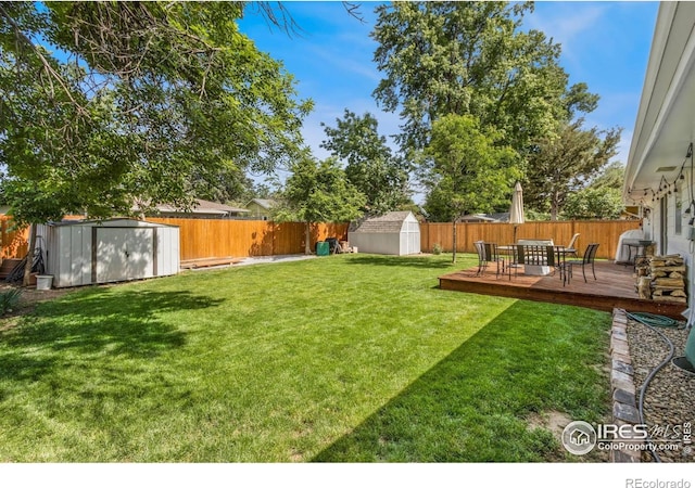 408 Riddle Dr, Fort Collins, CO 80521 - fenced backyard with a storage shed and a deck
