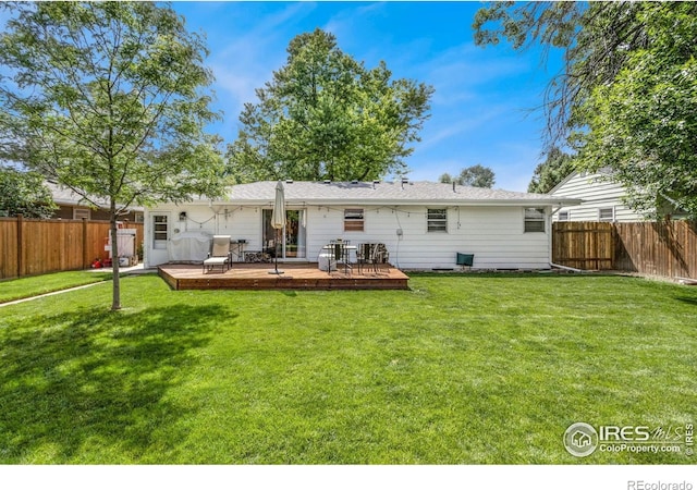 408 Riddle Dr, Fort Collins, CO 80521 - back of property with a fenced backyard and a deck