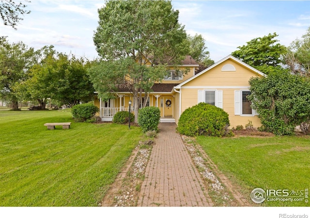 991 Peaceful View Pl, Johnstown, CO 80534 - view of front of property featuring covered porch and a front yard