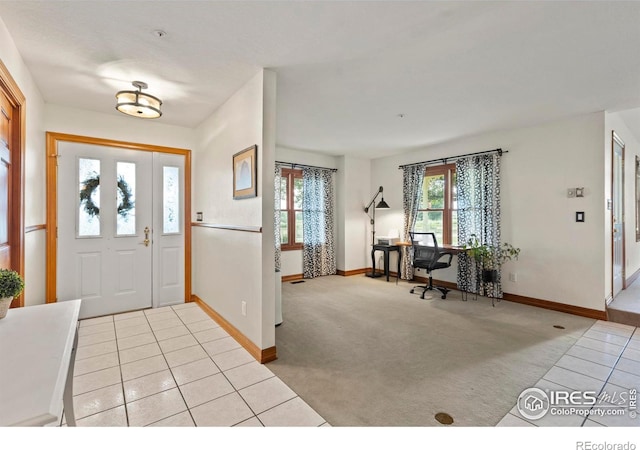 991 Peaceful View Pl, Johnstown, CO 80534 - entrance foyer featuring light tile patterned floors and light colored carpet