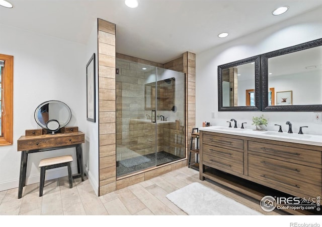 991 Peaceful View Pl, Johnstown, CO 80534 - full bathroom with double vanity, a stall shower, wood finished floors, and recessed lighting