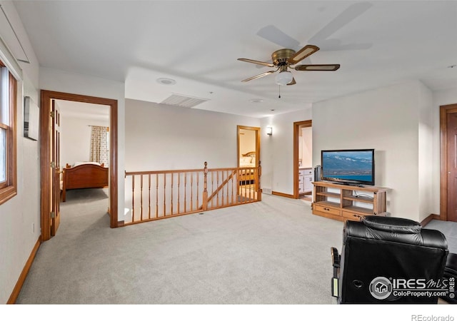 991 Peaceful View Pl, Johnstown, CO 80534 - carpeted living area with baseboards and a ceiling fan