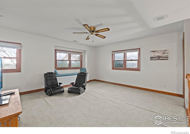 991 Peaceful View Pl, Johnstown, CO 80534 - living area with carpet, plenty of natural light, and a ceiling fan