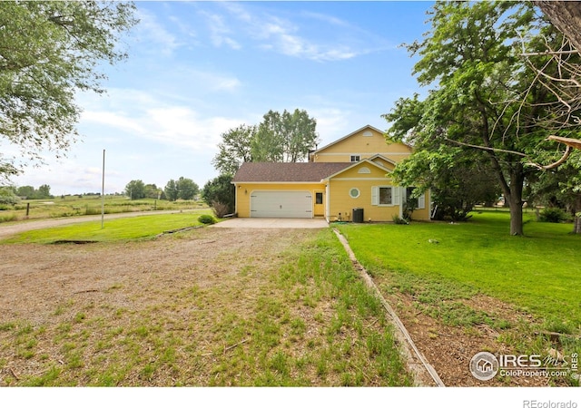 991 Peaceful View Pl, Johnstown, CO 80534 - view of front of house with dirt driveway, a garage, and a front yard