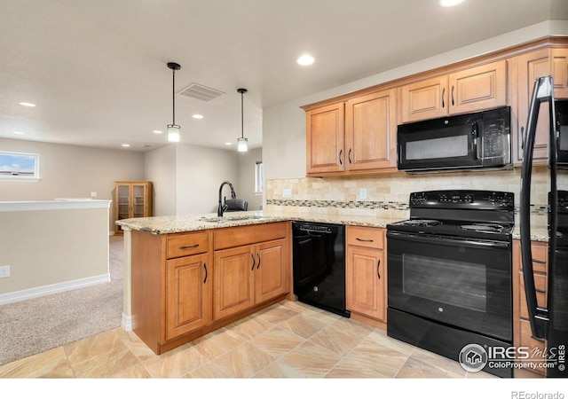 5954 Black Lion Ct, Windsor, CO 80550 - kitchen featuring black appliances, a peninsula, recessed lighting, light stone counters, and decorative backsplash