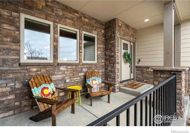 5954 Black Lion Ct, Windsor, CO 80550 - property entrance featuring stone siding