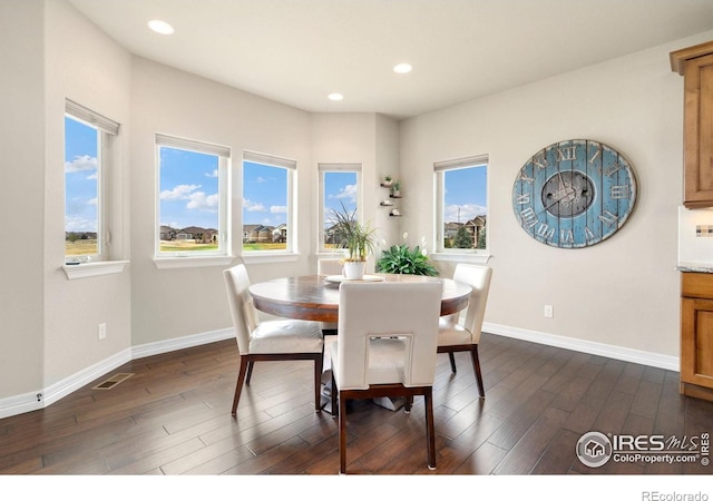 5954 Black Lion Ct, Windsor, CO 80550 - dining area with dark wood-style floors and recessed lighting