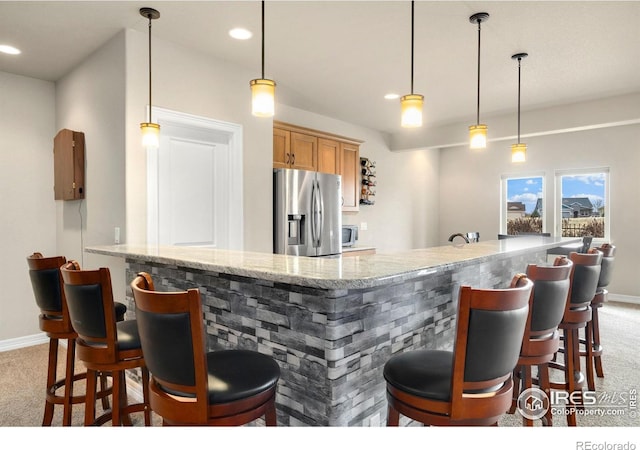 5954 Black Lion Ct, Windsor, CO 80550 - indoor wet bar with stainless steel refrigerator with ice dispenser, carpet floors, hanging light fixtures, and recessed lighting