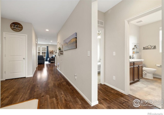 4822 Wildflower Pl, Dacono, CO 80514 - hallway featuring wood finished floors and recessed lighting