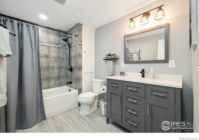 4822 Wildflower Pl, Dacono, CO 80514 - bathroom featuring wood finished floors, vanity, and shower / tub combo with curtain
