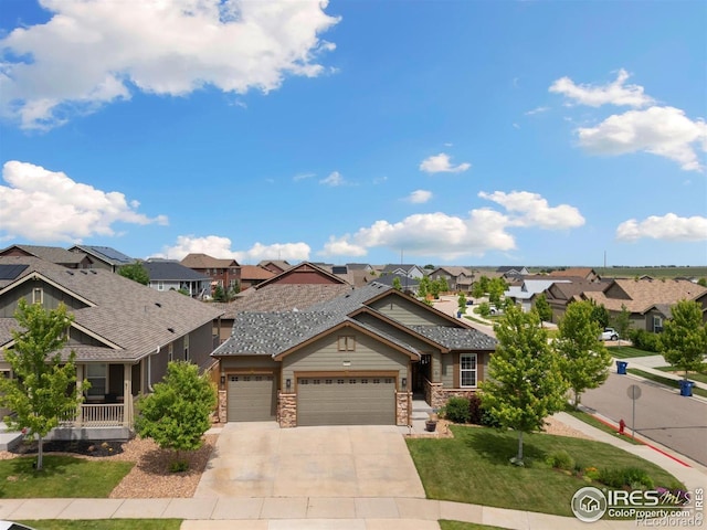 4822 Wildflower Pl, Dacono, CO 80514 - view of front of property with a residential view, a garage, concrete driveway, a front yard, and stone siding