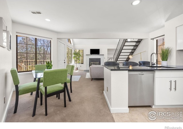 5904 Gunbarrel Ave Unit B, Boulder, CO 80301 - dining area with a glass covered fireplace, recessed lighting, stairway, and light colored carpet