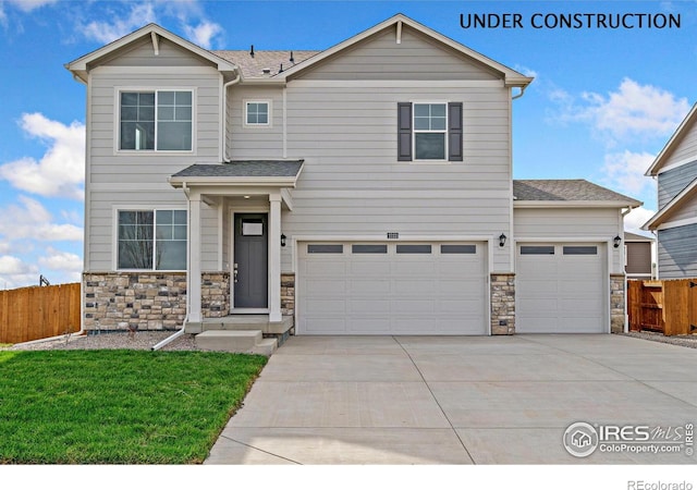 13804 Quartz St, Mead, CO 80504 - view of front of home with stone siding, concrete driveway, a garage, and a shingled roof