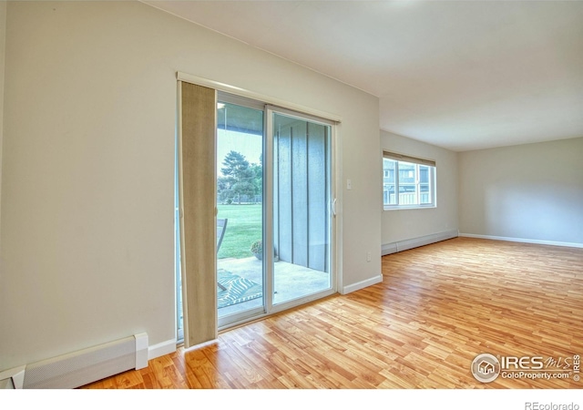 801 E Drake Rd Unit G77, Fort Collins, CO 80525 - unfurnished room with baseboard heating and wood finished floors