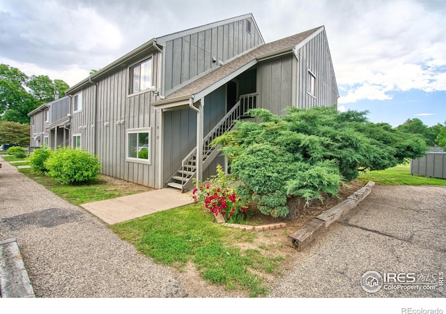 801 E Drake Rd Unit G77, Fort Collins, CO 80525 - view of front of home with stairs and board and batten siding