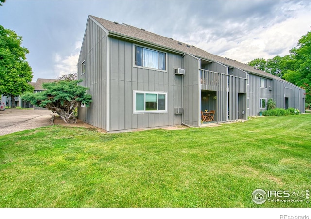 801 E Drake Rd Unit G77, Fort Collins, CO 80525 - rear view of property featuring a lawn and a shingled roof