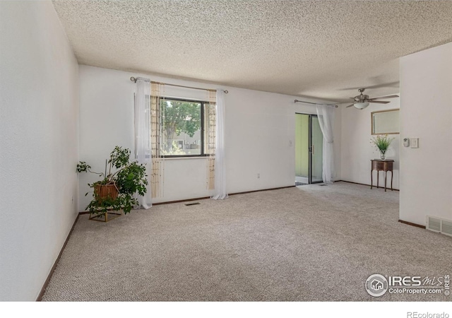 1410 Bacchus Dr Unit B12, Lafayette, CO 80026 - empty room with carpet, a textured ceiling, and ceiling fan