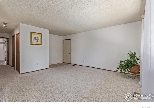 1410 Bacchus Dr Unit B12, Lafayette, CO 80026 - unfurnished room featuring carpet and a textured ceiling