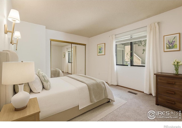 1410 Bacchus Dr Unit B12, Lafayette, CO 80026 - carpeted bedroom with a closet and baseboards
