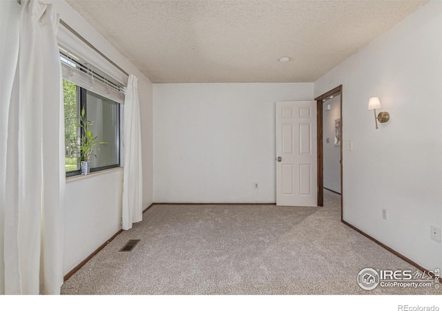 1410 Bacchus Dr Unit B12, Lafayette, CO 80026 - carpeted spare room with a textured ceiling