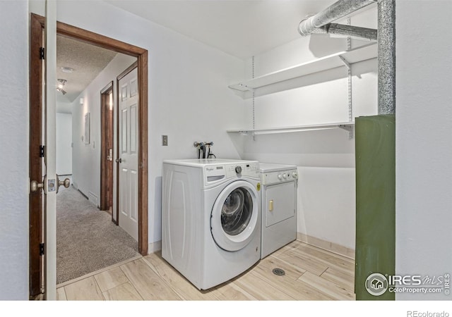1410 Bacchus Dr Unit B12, Lafayette, CO 80026 - laundry room with washing machine and dryer and light wood-style floors