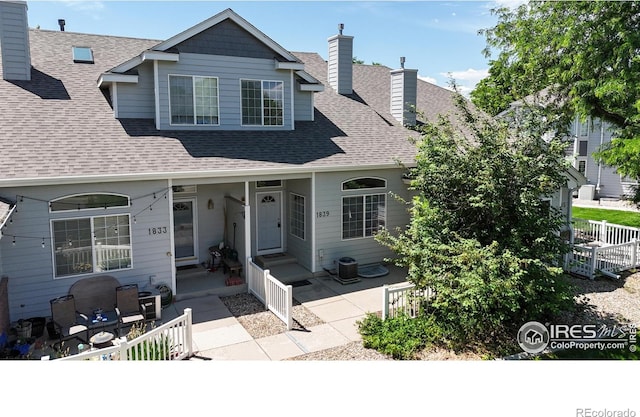 1839 Laurus Ln, Johnstown, CO 80534 - view of front of house with roof with shingles and a chimney