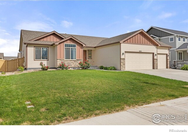 6818 Meadow Rain Way, Wellington, CO 80549 - craftsman-style house featuring board and batten siding, stone siding, an attached garage, concrete driveway, and roof with shingles