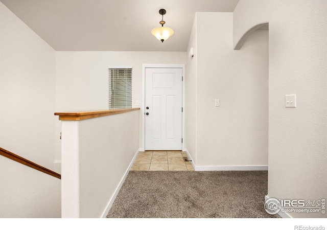 6818 Meadow Rain Way, Wellington, CO 80549 - hallway featuring carpet flooring and tile patterned flooring