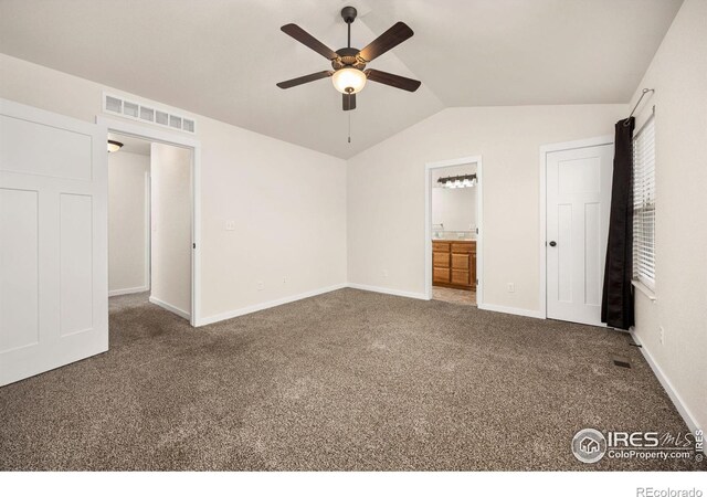 6818 Meadow Rain Way, Wellington, CO 80549 - unfurnished bedroom featuring carpet flooring, vaulted ceiling, ensuite bathroom, and ceiling fan