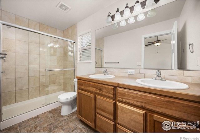 6818 Meadow Rain Way, Wellington, CO 80549 - full bath with double vanity, a stall shower, and a ceiling fan