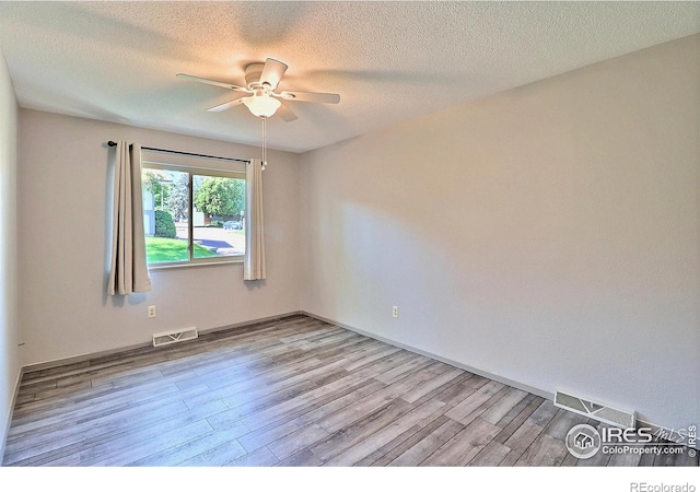3405 W 16th St Unit 30, Greeley, CO 80634 - spare room featuring ceiling fan, light wood-type flooring, and a textured ceiling