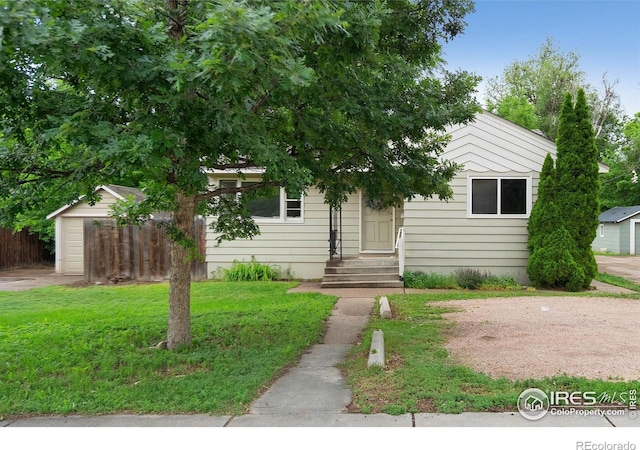 1202 Mathews St, Fort Collins, CO 80524 - view of property hidden behind natural elements featuring a garage