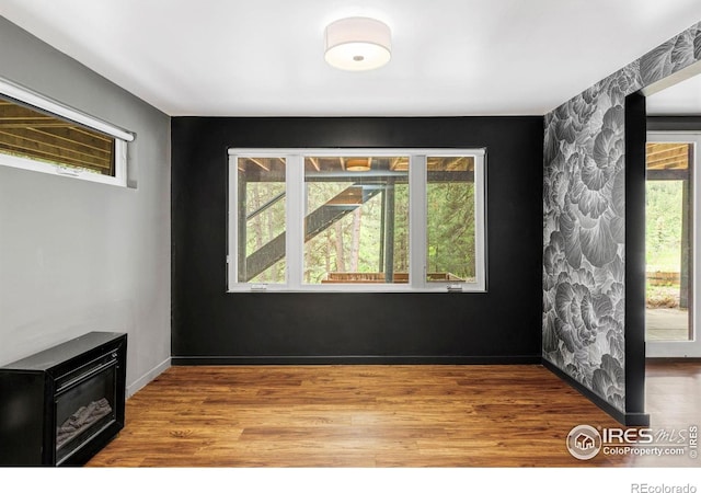 781 Cold Springs Rd, Nederland, CO 80466 - empty room featuring healthy amount of natural light and wood finished floors
