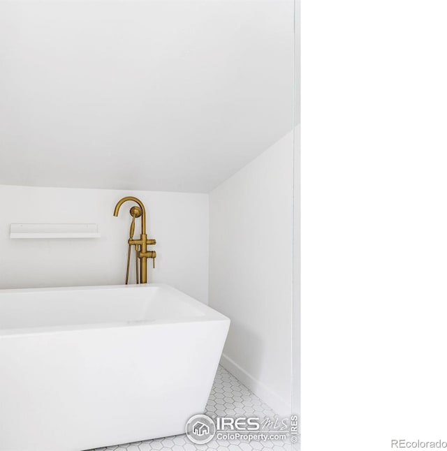781 Cold Springs Rd, Nederland, CO 80466 - full bath featuring a freestanding bath and tile patterned flooring