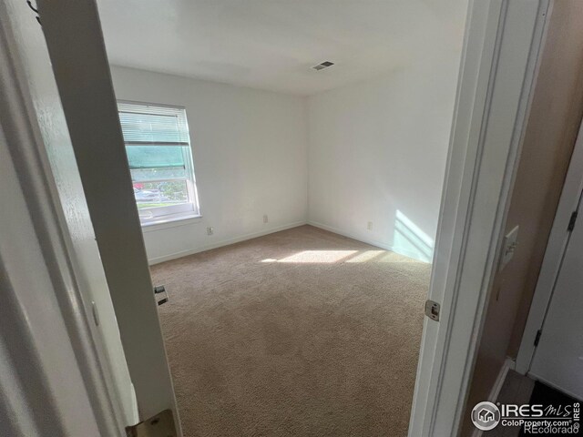 225 E 8th Ave Unit B11, Longmont, CO 80504 - empty room with carpet and baseboards