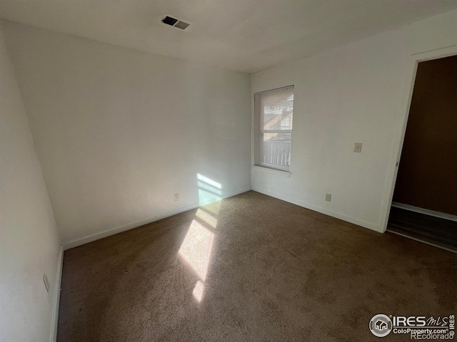225 E 8th Ave Unit B11, Longmont, CO 80504 - spare room with dark carpet