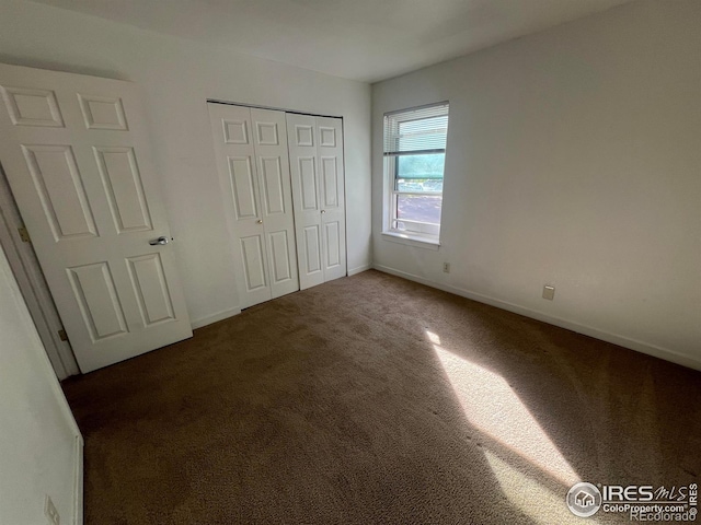 225 E 8th Ave Unit B11, Longmont, CO 80504 - unfurnished bedroom featuring carpet flooring and a closet