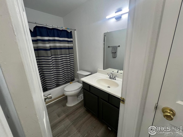 225 E 8th Ave Unit B11, Longmont, CO 80504 - bathroom featuring vanity, wood finished floors, and shower / bathtub combination with curtain