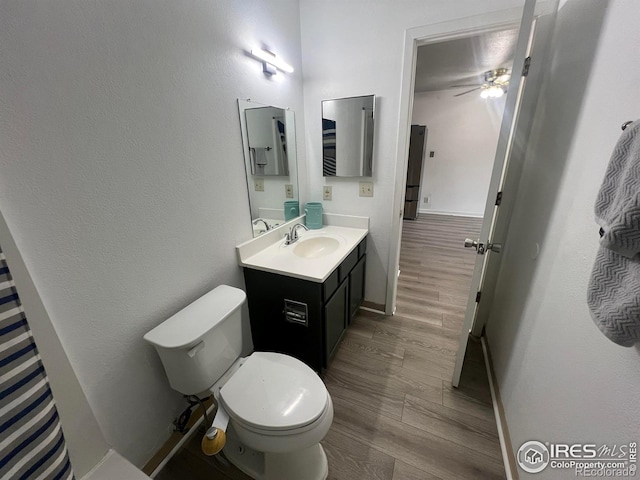 225 E 8th Ave Unit B11, Longmont, CO 80504 - bathroom featuring vanity, wood finished floors, and a ceiling fan