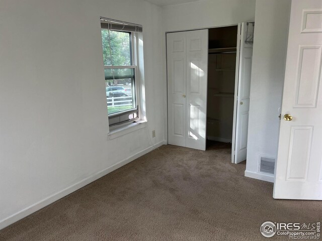 225 E 8th Ave Unit B11, Longmont, CO 80504 - unfurnished bedroom with carpet flooring and a closet