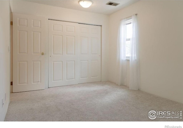 3345 Chisholm Trl Unit 206, Boulder, CO 80301 - unfurnished bedroom with carpet floors and a closet