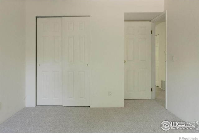 3345 Chisholm Trl Unit 206, Boulder, CO 80301 - unfurnished bedroom featuring carpet and a closet