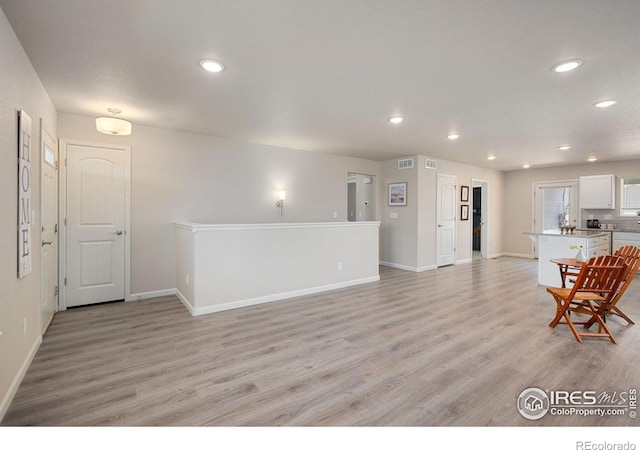 4216 Yellowbells Dr, Evans, CO 80620 - living room featuring light wood-type flooring and recessed lighting