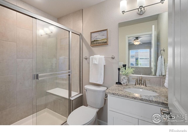 4216 Yellowbells Dr, Evans, CO 80620 - full bathroom featuring vanity, a shower stall, and a ceiling fan
