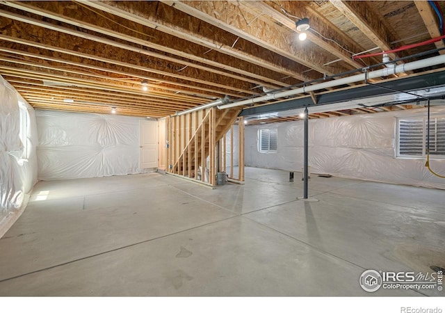 4216 Yellowbells Dr, Evans, CO 80620 - unfinished below grade area featuring stairway