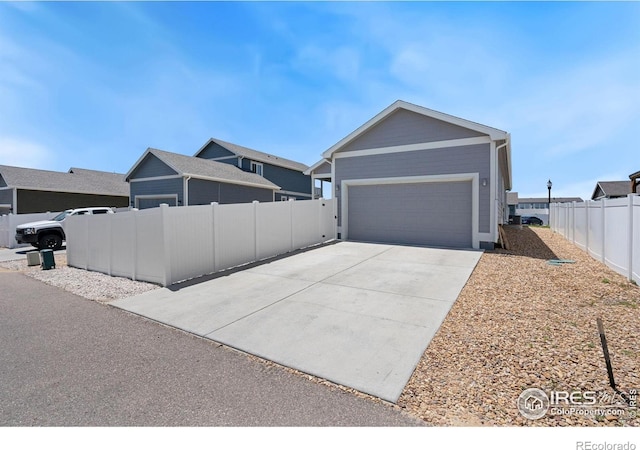 4216 Yellowbells Dr, Evans, CO 80620 - view of side of home with driveway and a garage