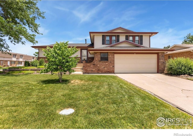 610 S Broadway Ave, Fort Lupton, CO 80621 - tri-level home with concrete driveway, a front yard, brick siding, and a garage