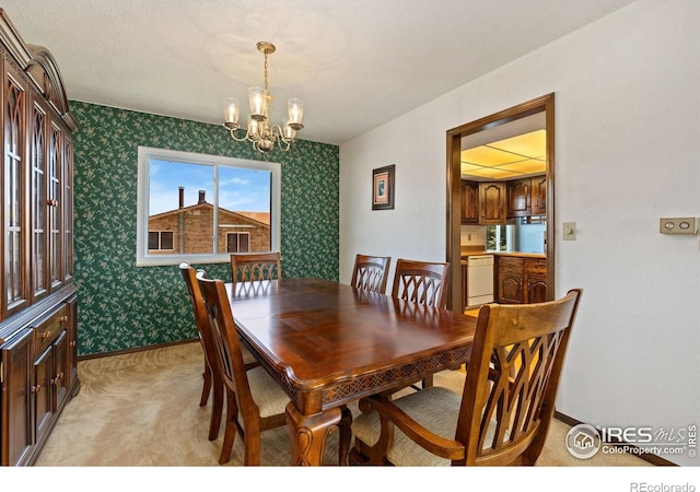610 S Broadway Ave, Fort Lupton, CO 80621 - dining area featuring wallpapered walls, a chandelier, and light carpet