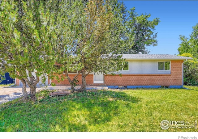 131 E 15th Ave, Longmont, CO 80504 - view of front of home with brick siding, a front yard, and concrete driveway