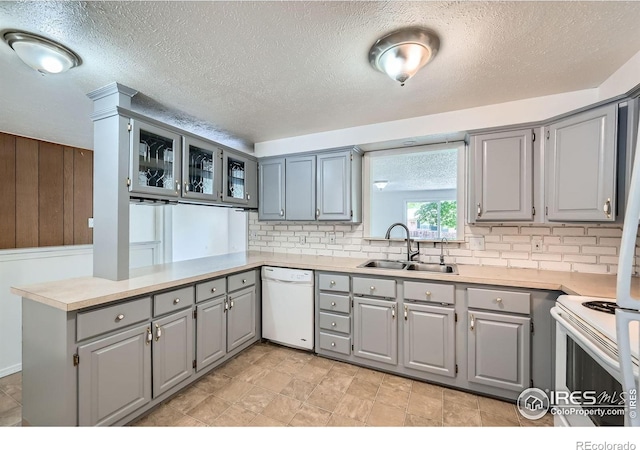 131 E 15th Ave, Longmont, CO 80504 - kitchen featuring gray cabinets, white appliances, a peninsula, decorative backsplash, and a textured ceiling